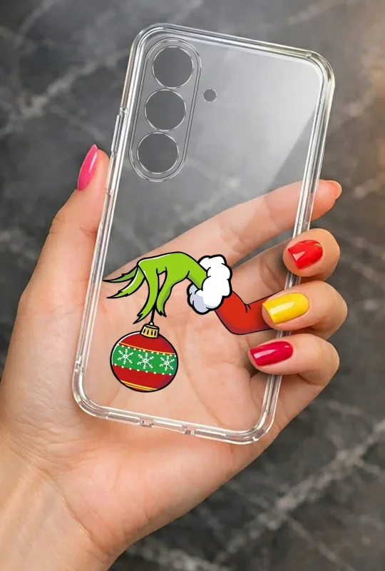 Etui świąteczne przezroczyste do Samsung Galaxy S26+ Plus z motywem Grincha - prezentacja case w dłoni