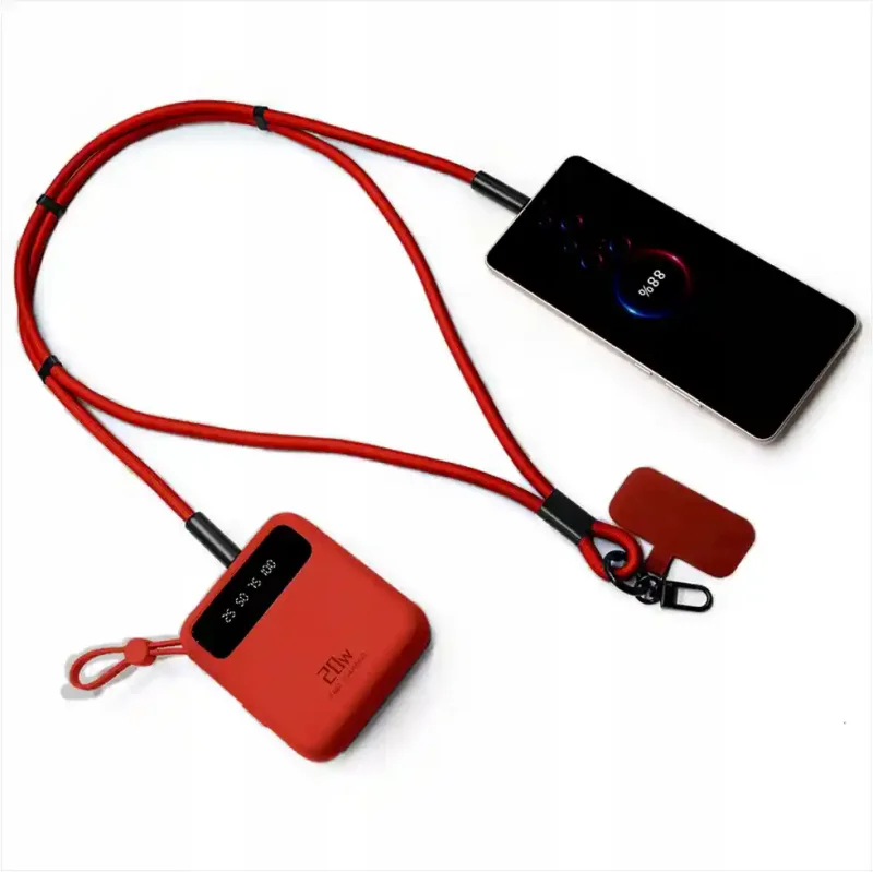 Czerwona zawieszka USB-C 60W podłączona do smartfona i powerbanku podczas ładowania