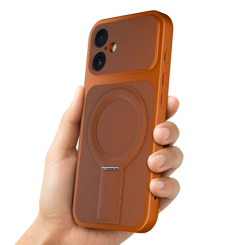 Pomarańczowe etui magnetyczne do iPhone 16 pokazane w dłoni