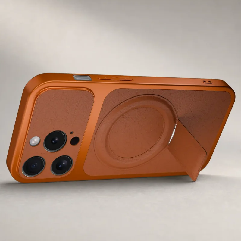 Pomarańczowe etui do iPhone 14 Pro ustawione poziomo dzięki składanej podpórce