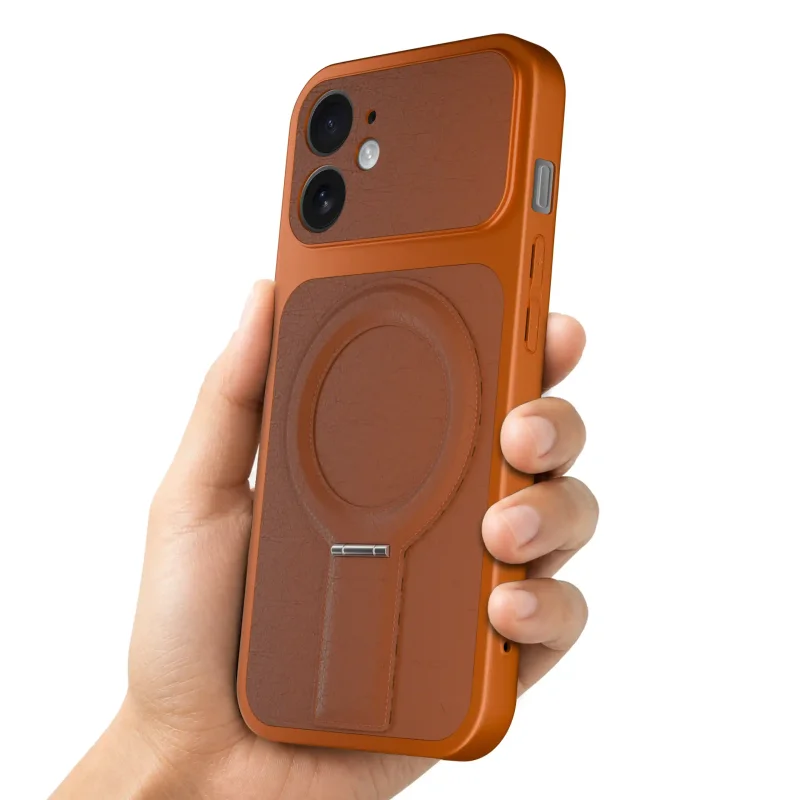 Pomarańczowe etui magnetyczne do iPhone 11 prezentowane w dłoni