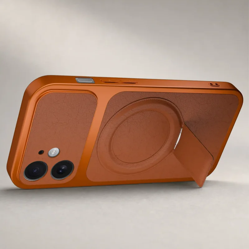 Pomarańczowe etui do iPhone 11 ustawione poziomo dzięki składanej podpórce