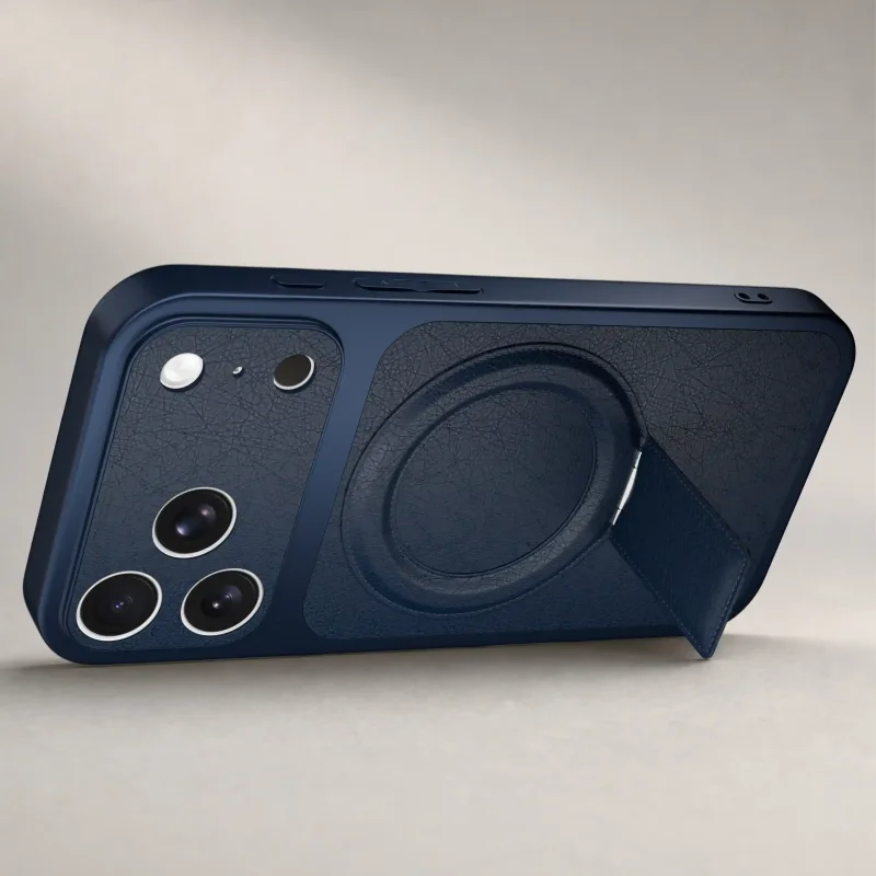 Granatowe etui do iPhone 17 Pro ustawione poziomo dzięki składanej podpórce
