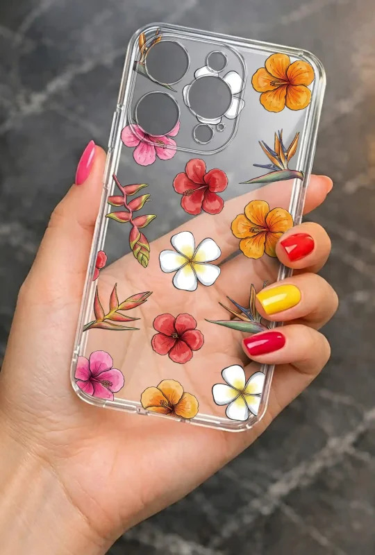 Przezroczyste etui kwiatowe do iPhone 16 Pro z nadrukiem hibiskusów i strelicji, prezentowane w dłoni
