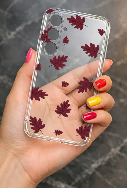 Przezroczyste etui do Samsung Galaxy A25 5G z bordowym motywem jesiennych liści prezentowane w dłoni