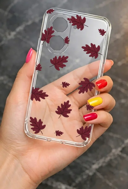 Przezroczyste etui do Xiaomi Redmi A5 z motywem bordowych jesiennych liści prezentowane w dłoni